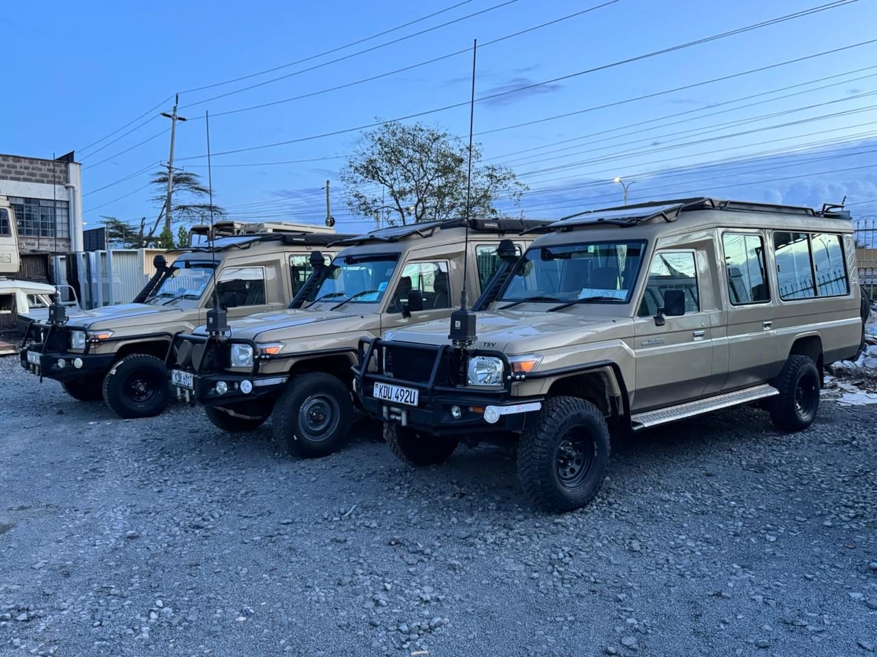 Three safari Land Cruisers ready for ground transport
